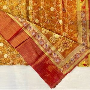 Heavy Indian silk saree with a shade of orange and intricate gold work!
